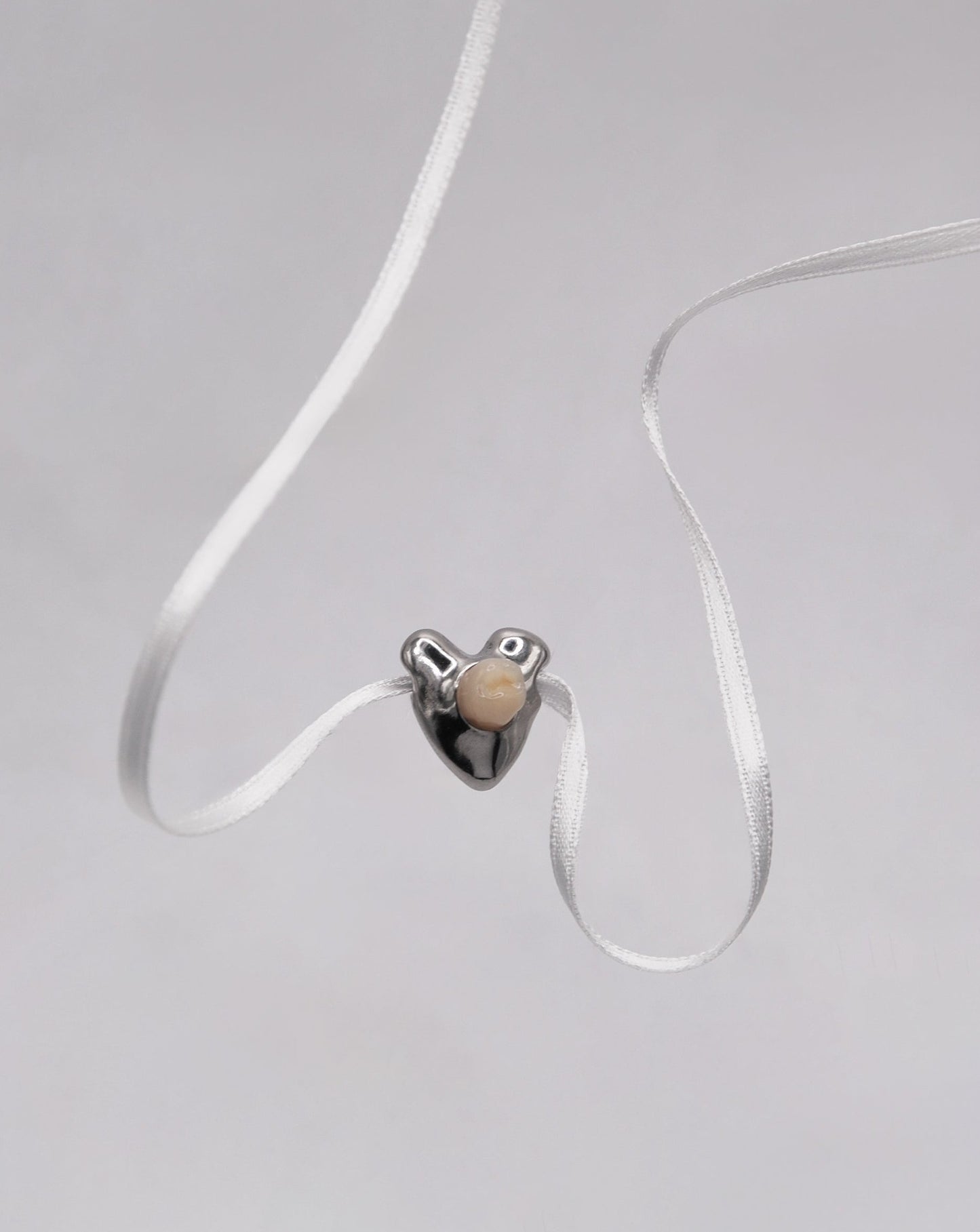 Pendentif coeur - molaire sertie